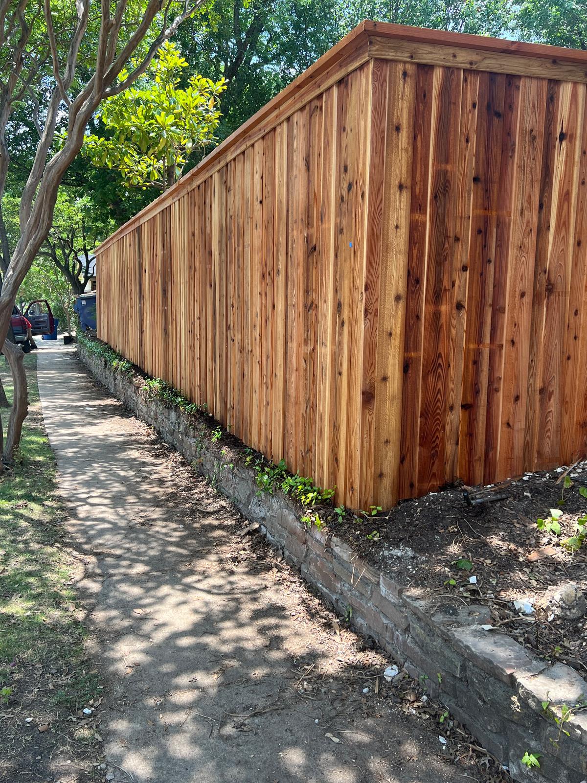 Corner detail of the cedar fence on the retaining wall