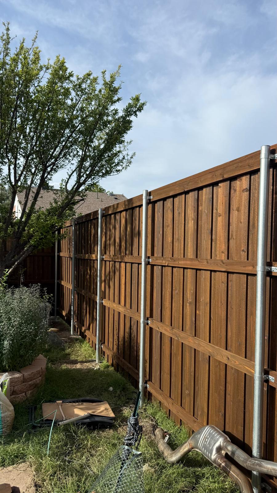 Rails framed and clamped to steel posts